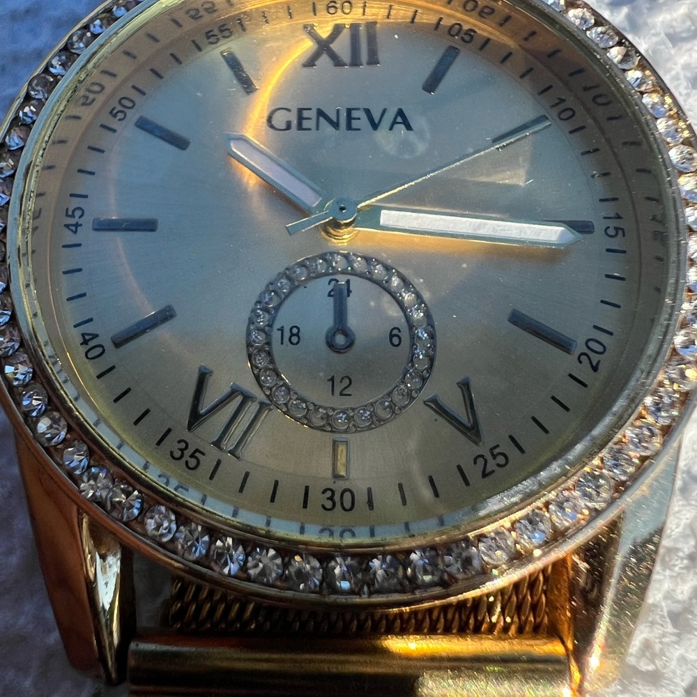 Geneva Gold Womens Watch with Crystal Bezel. 1 1/4” side to side on face.